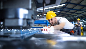 factory-worker-protective-uniform-hardhat-operating-industrial-machine-production-line