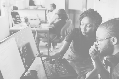 Man and woman Looking At Computer