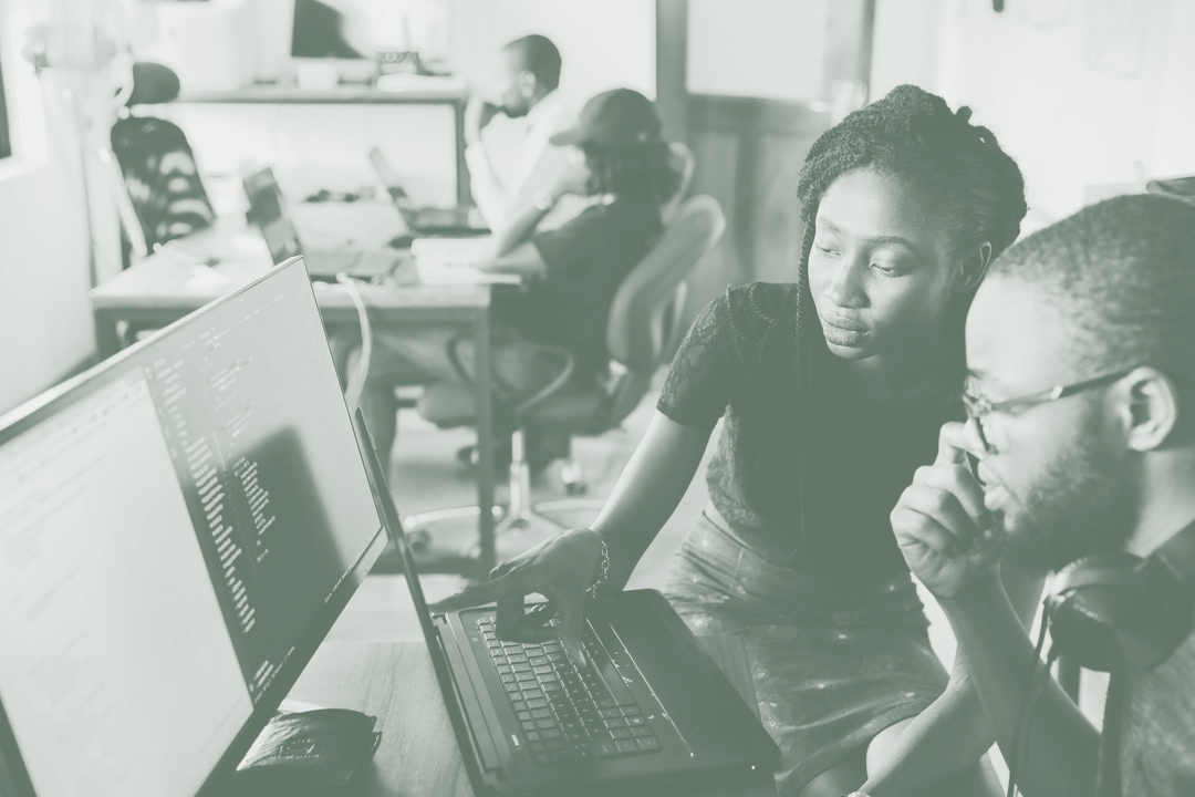 Man And Woman Working On Computer