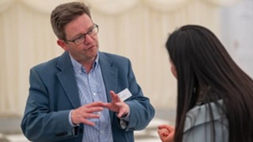 Man Talking To Student