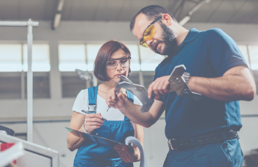 Mechanics Looking At Tools