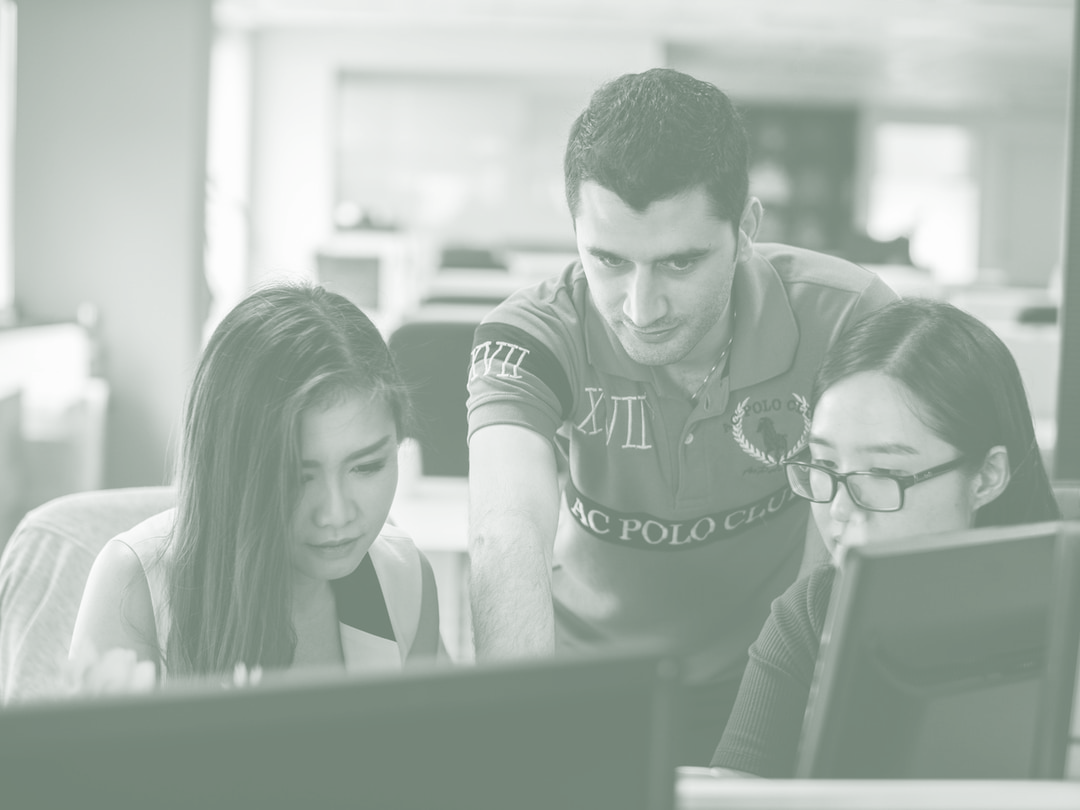 Group Looking At Computer