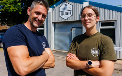 Catherine and Liam standing in front of Fitness Rush 
