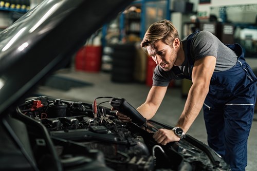 Mechanic Working On Car